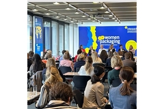 Image Women gathered listening to the "Women in Packaging" panel at Interpack 2023.